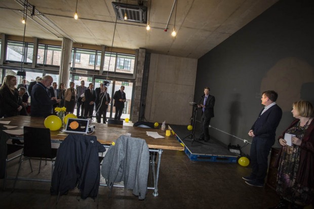 Group of people gathered in new room called the Furnace at TechHub