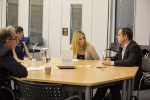 Dave Perry and team sitting around a table