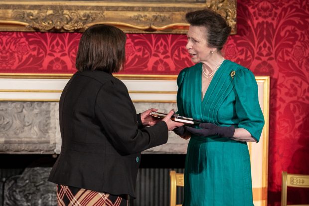 Deborah Nicholas being handed an award from Princess Anne