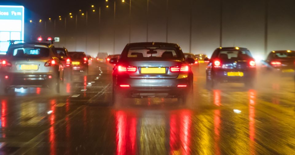 Cars on the motorway at night in the rain